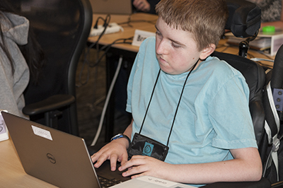 A student using a computer. A student using a computer.