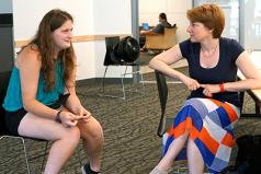 A student discusses interview strategies with an employer. A student discusses interview strategies with an employer.