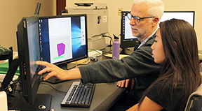 AccessCSforAll PI Richard Ladner shows a student how to use Quorum. AccessCSforAll PI Richard Ladner shows a student how to use Quorum.