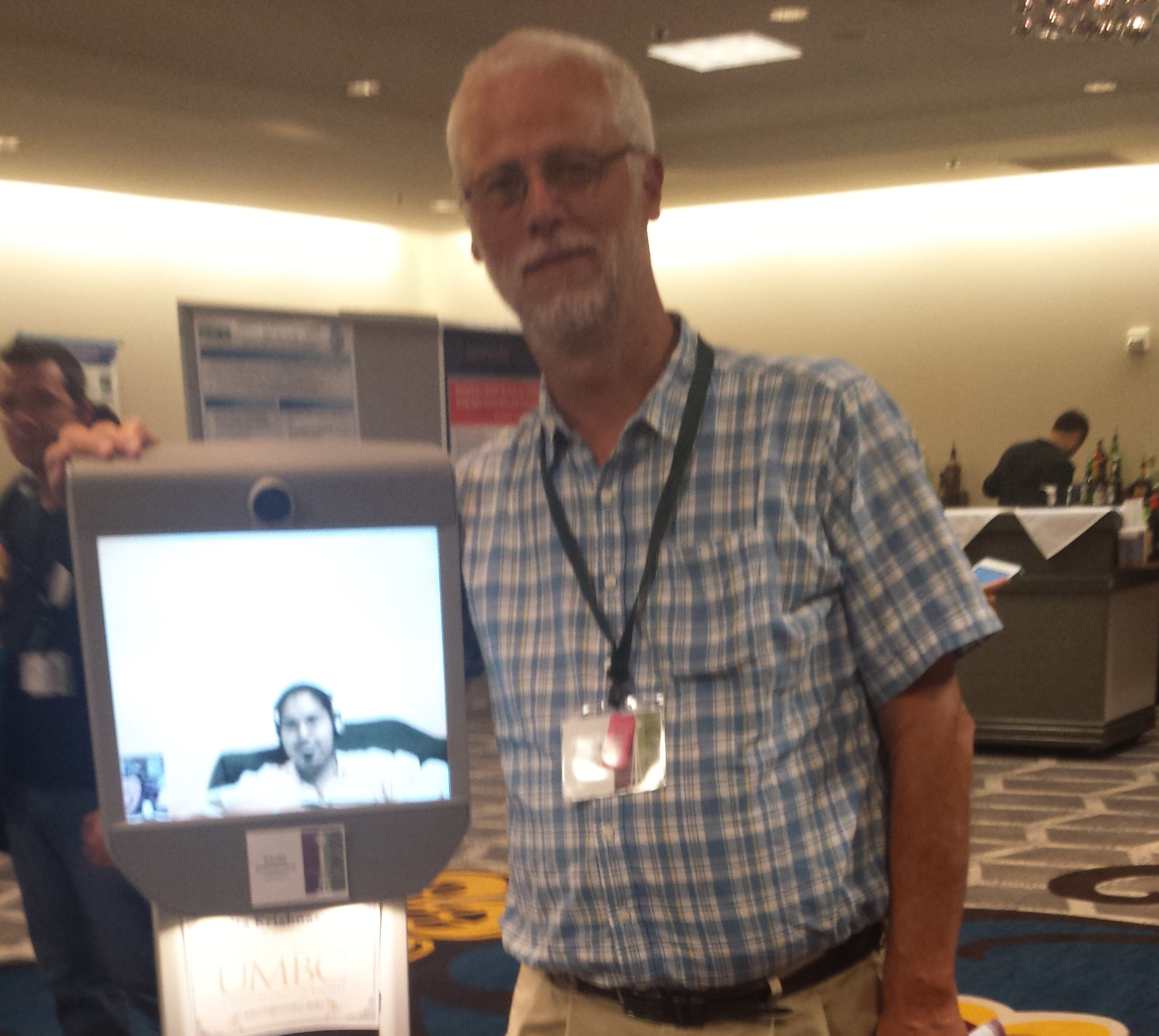 Richard Ladner standing next to Kavita (on screen) in her Beam Robot. Richard Ladner standing next to Kavita (on screen) in her Beam Robot.