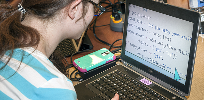A student with low vision works on a computing project